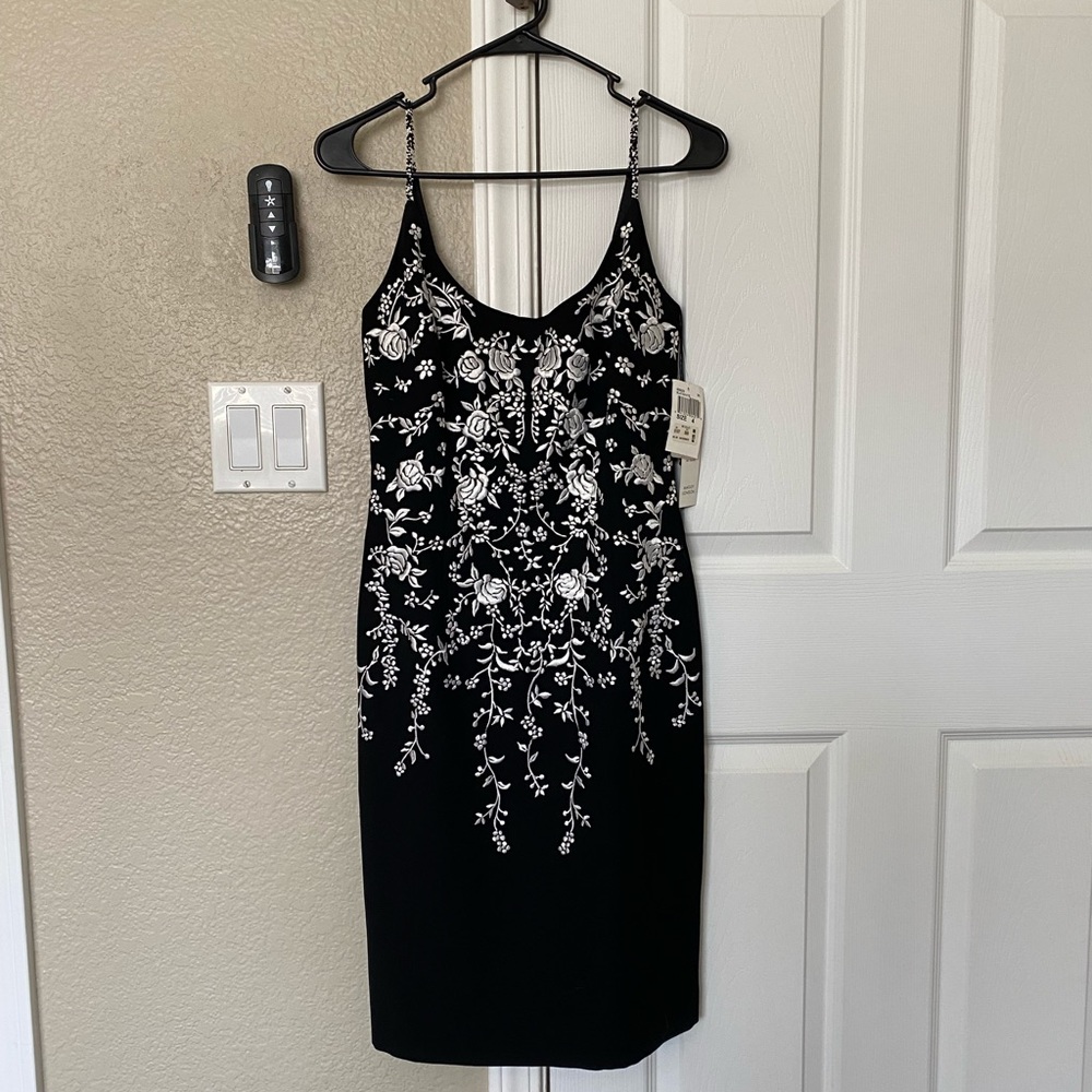 Size 4 black Maggy London dress floral embroidery.